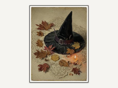 Classic witch hat on lace with dried autumn leaves